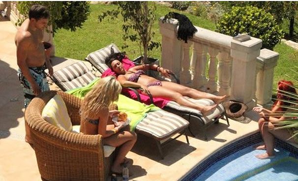  She was even spotted in the villa with the other cast sunbathing