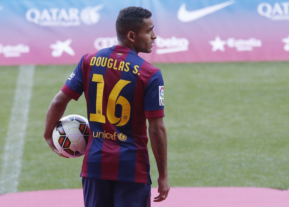  Douglas was unveiled as a Barcelona player in August 2014