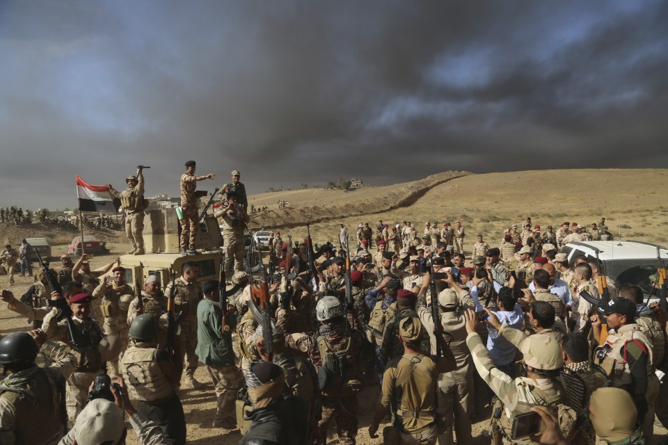  Iraqi forces celebrate territory gains... as jihadis panic and cut beards to blend in when city falls