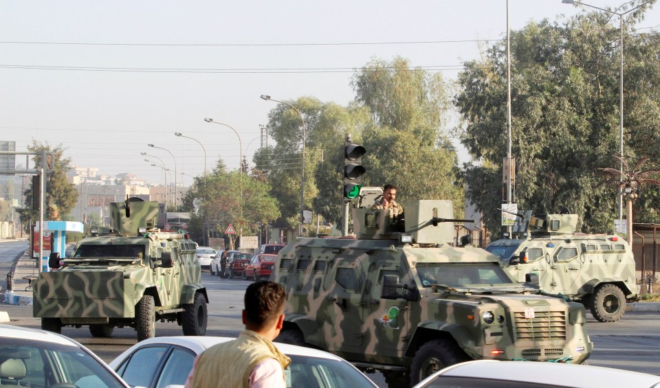  Peshmerga military vehicles storm the site of the ISIS attack