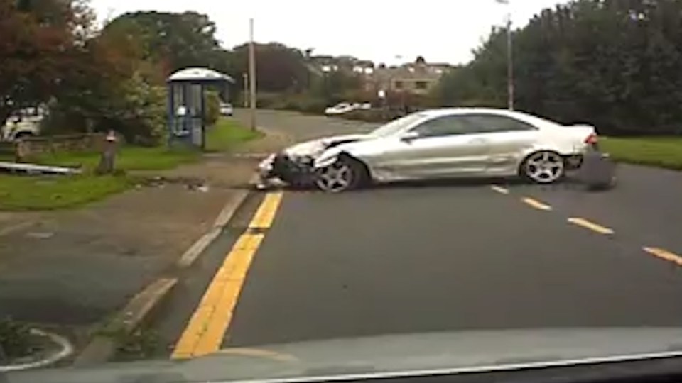  The expensive sporty vehicle is left a complete mess after hitting a lamppost and two garden walls before grinding to a halt