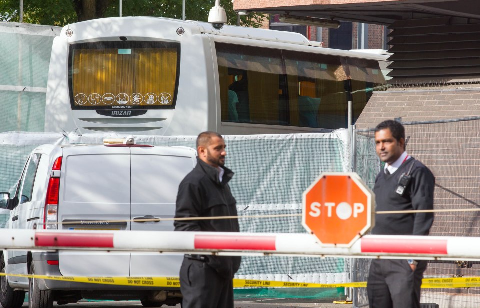  Three coachloads of 'child' refugees arrived in the UK yesterday but were blocked from view by a 15ft fence