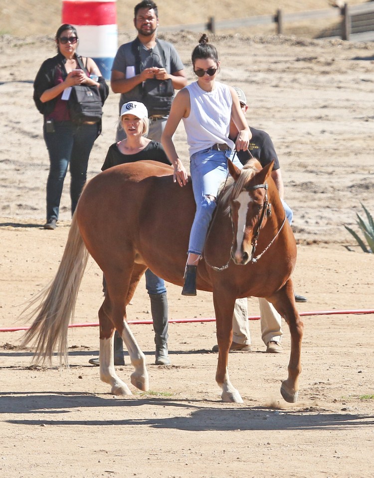  She styled her stone wash denim jeans with a white tank top