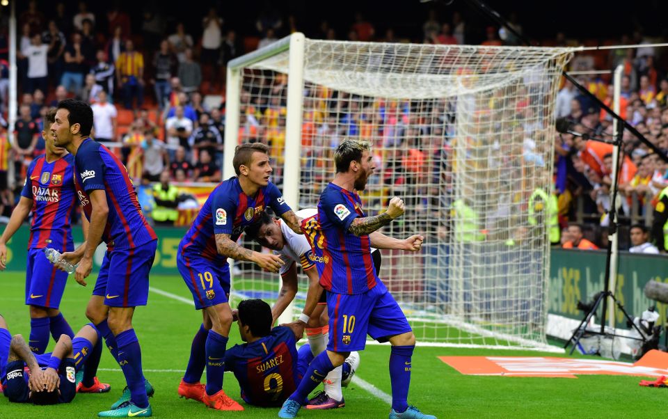  Valencia fans threw bottles at Barcelona players after Lionel Messi's last minute penalty