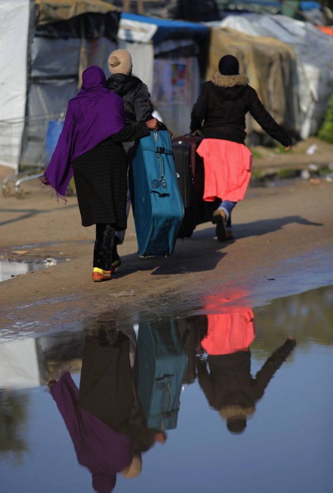  Huge numbers of people have been made to pack up their belongings at the Calais Jungle