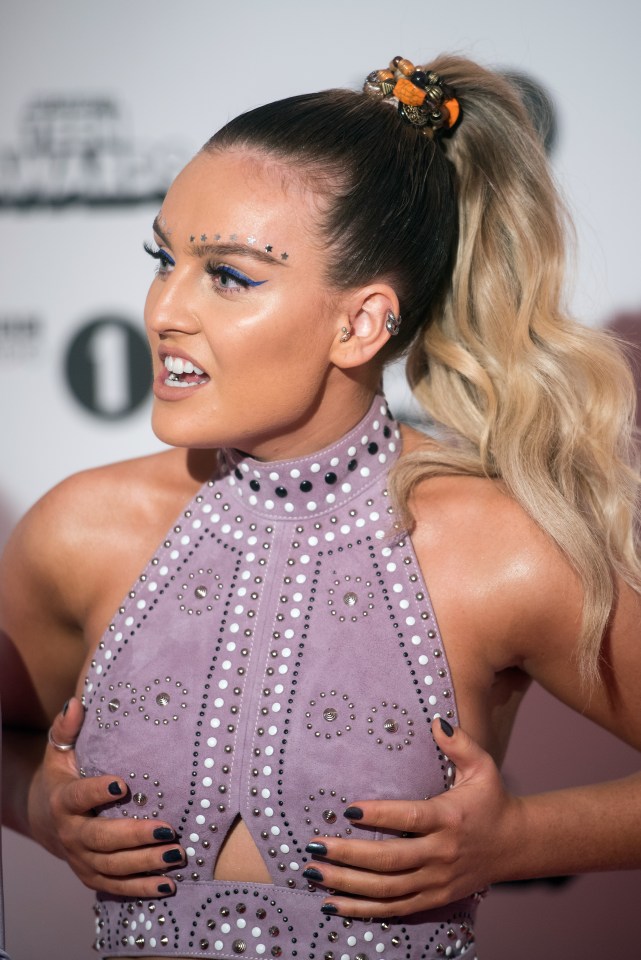  Perrie Edwards grabbed her boobs as she posed for snaps