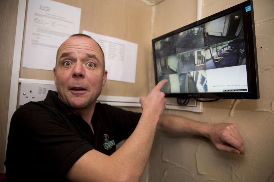 Landlord James next to the TV monitor where his staff saw the footage