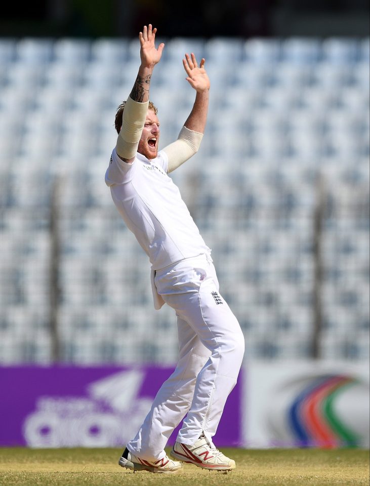  Ben Stokes raises his arms in the air as he celebrates taking the winning wicket