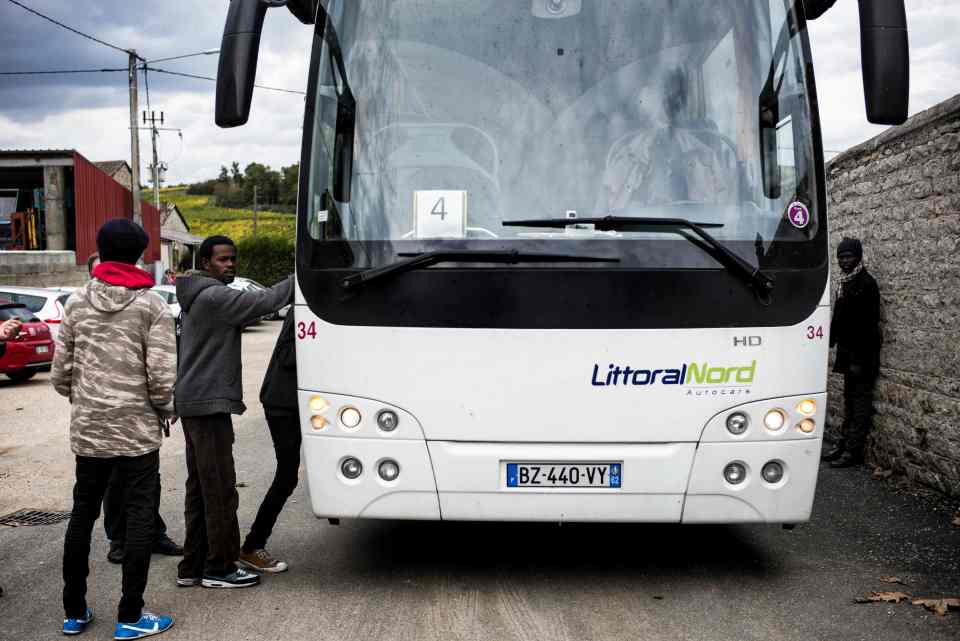  Migrants arrive by bus in the Chardonnay from the Calais Jungle