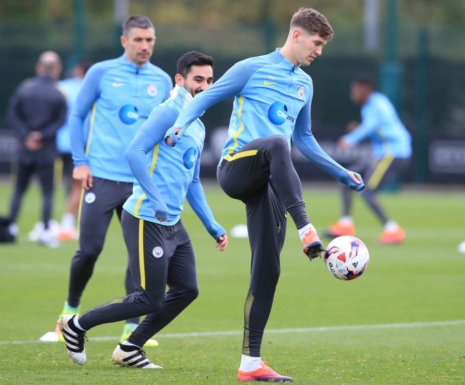  John Stones shows off his control as Kolarov and Gundogan look on