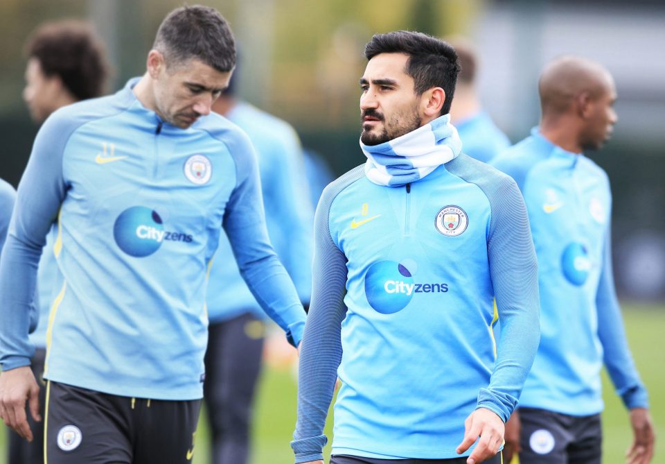  Ilkay Gundogan wears his snood in training as he and his team-mates get ready to face United