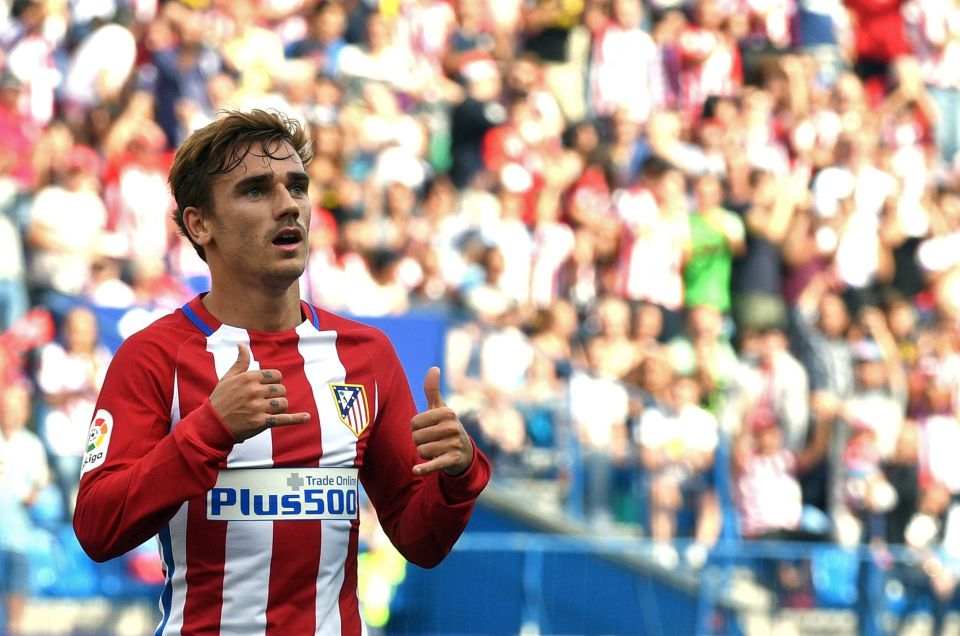 (FILES) This file photo taken on September 17, 2016 shows Atletico Madrid's French forward Antoine Griezmann celebrating after scoring during the Spanish league football match Club Atletico de Madrid vs Real Sporting de Gijon at the Vicente Calderon stadium in Madrid. Atletico Madrid's French forward Antoine Griezmann was named La Liga player of the season for 2015/16 on October 24, 2016, ahead of the likes of star duo Lionel Messi and Cristiano Ronaldo. / AFP PHOTO / GERARD JULIENGERARD JULIEN/AFP/Getty Images