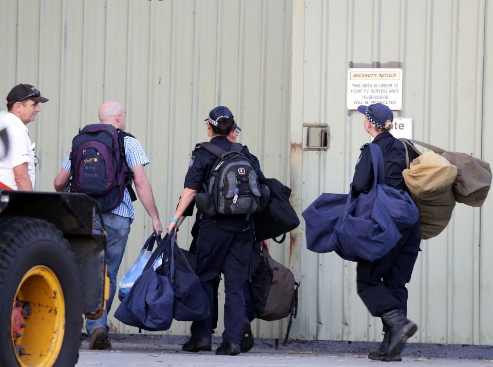  Queensland Police officers enter the park after the tragic, fatal accident