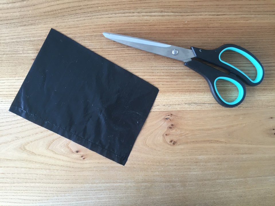  Cut out some rectangles from black bin bags and fold in half to create a square