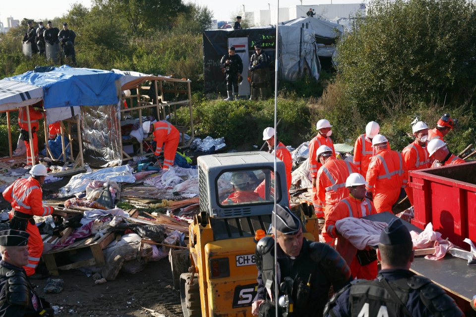  Workers move in to tear down the buildings