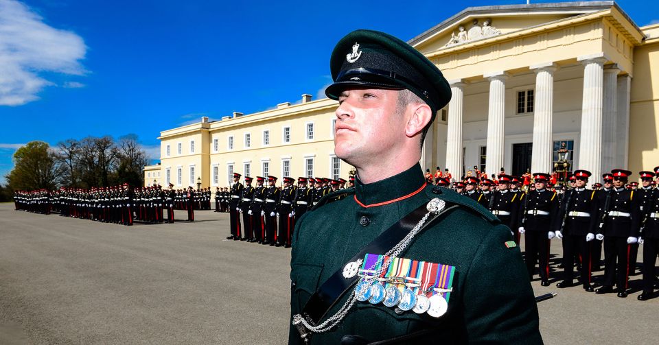 Bombardier Murray Kerr RA can be seen standing to attention with strict army lines behind him