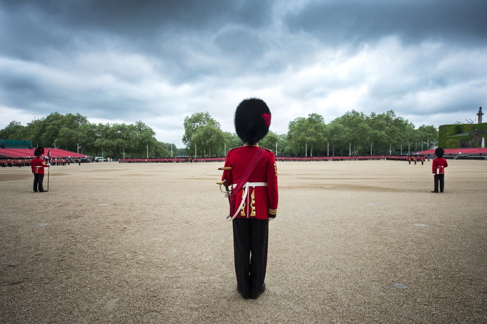 A soldier can be seen standing to attention in his Redcoat, with the stunning image just one of the many released by the Ministry of Defence