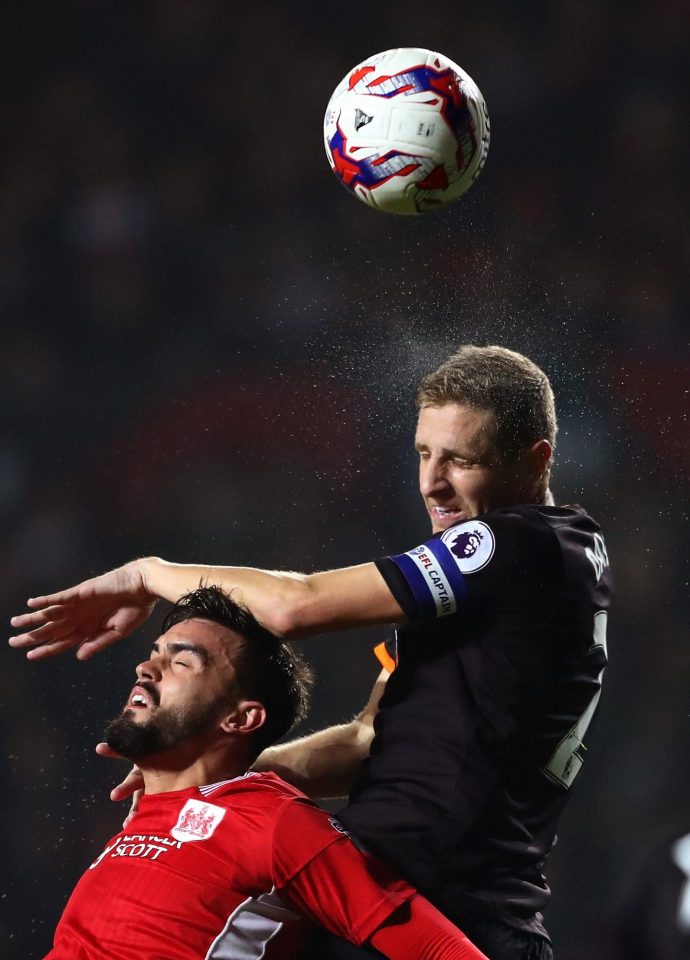  Hull City skipper Michael Dawson gets up to head but cant direct it at goal