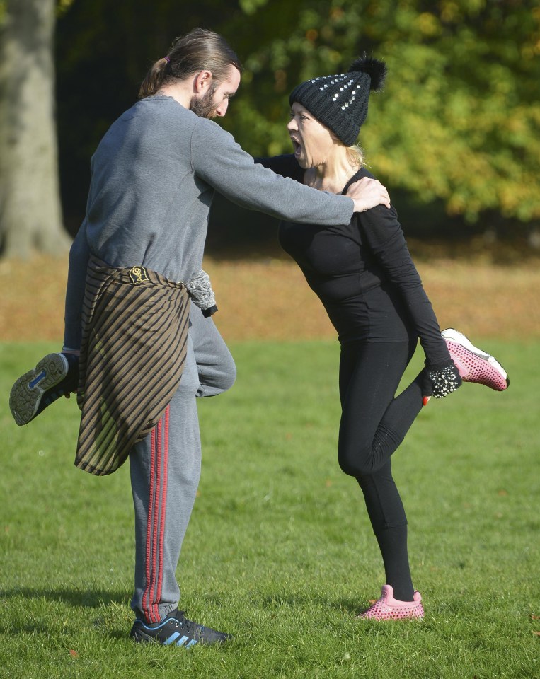 Paul helped her balance during the stretches