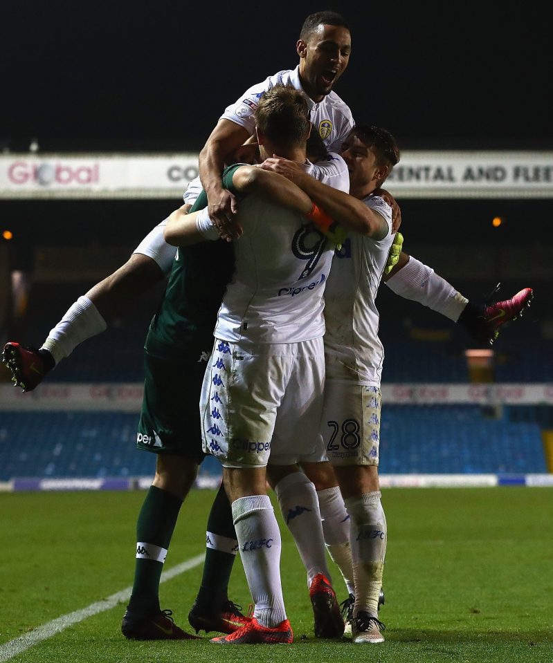  Chris Wood leads the congratulations for Leeds shootout hero Marco Silvestri, after they down Norwich