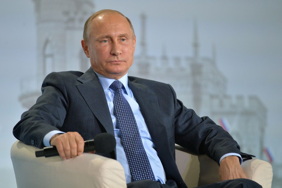 Russian President Vladimir Putin attends