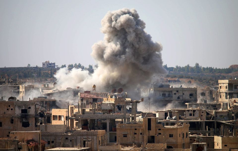  Smoke billows following an air strike by Syrian government forces in a rebel-held area of Daraa. Russia has clashed with the US over its backing for government troops