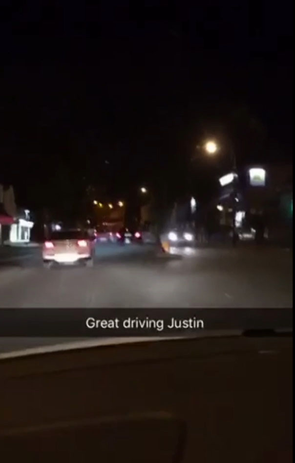  One of the cars veers into a lane of oncoming traffic while honking horn at local traffic to get past