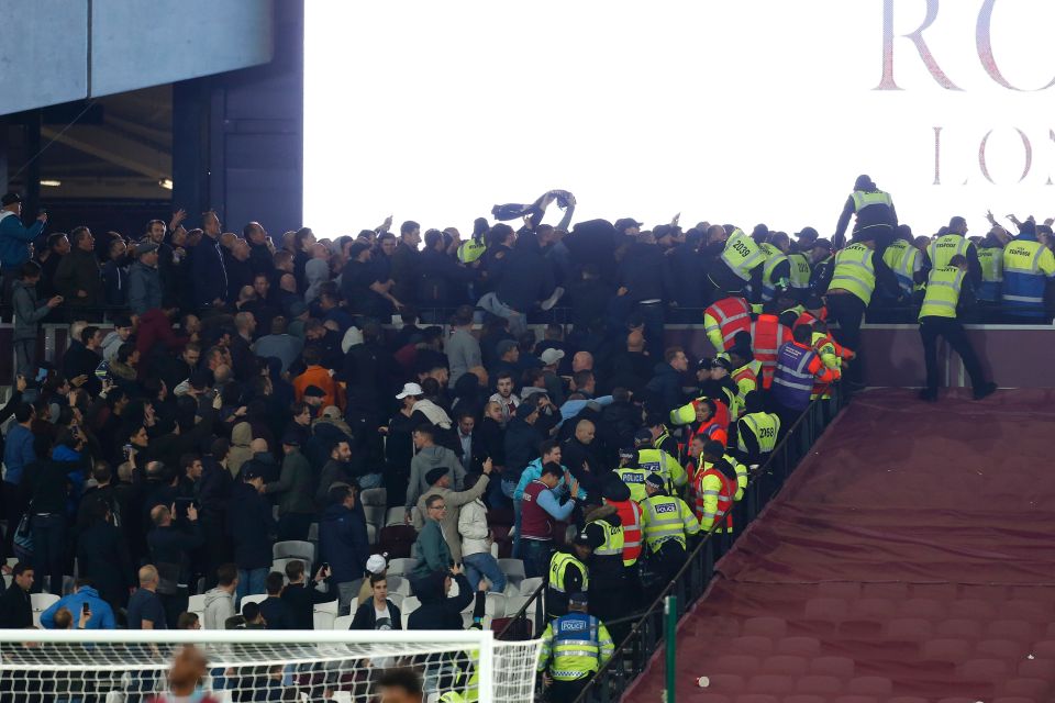 Stewards try to separate supporters of b