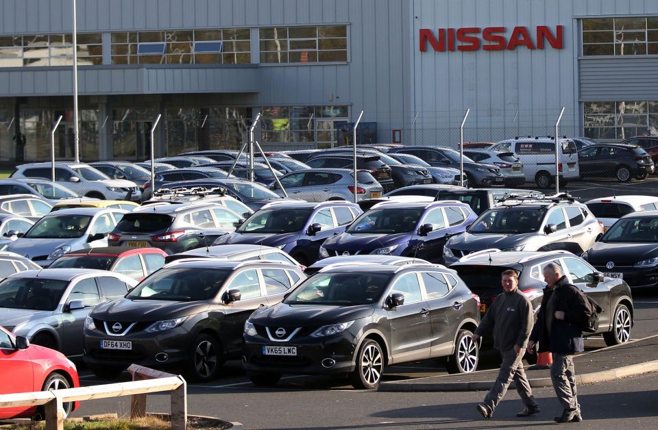  Workers leave the Nissan car plant after finishing their shift in Sunderland