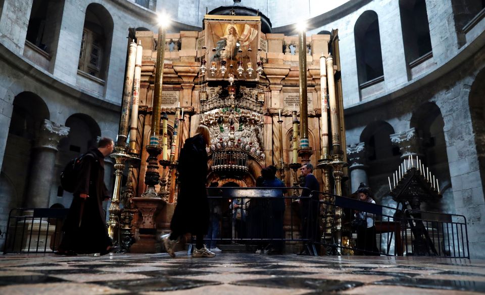  Holy site ... Christian worshippers queue to visit the Tomb of Christ at the Church of the Holy Sepulchre, which is undergoing restoration