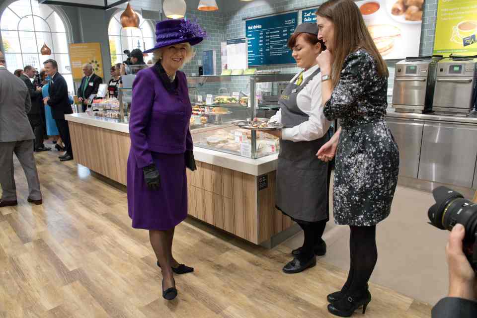  Camilla, Duchess of Cornwall chats with members of staff in Waitrose in the Poundbury development