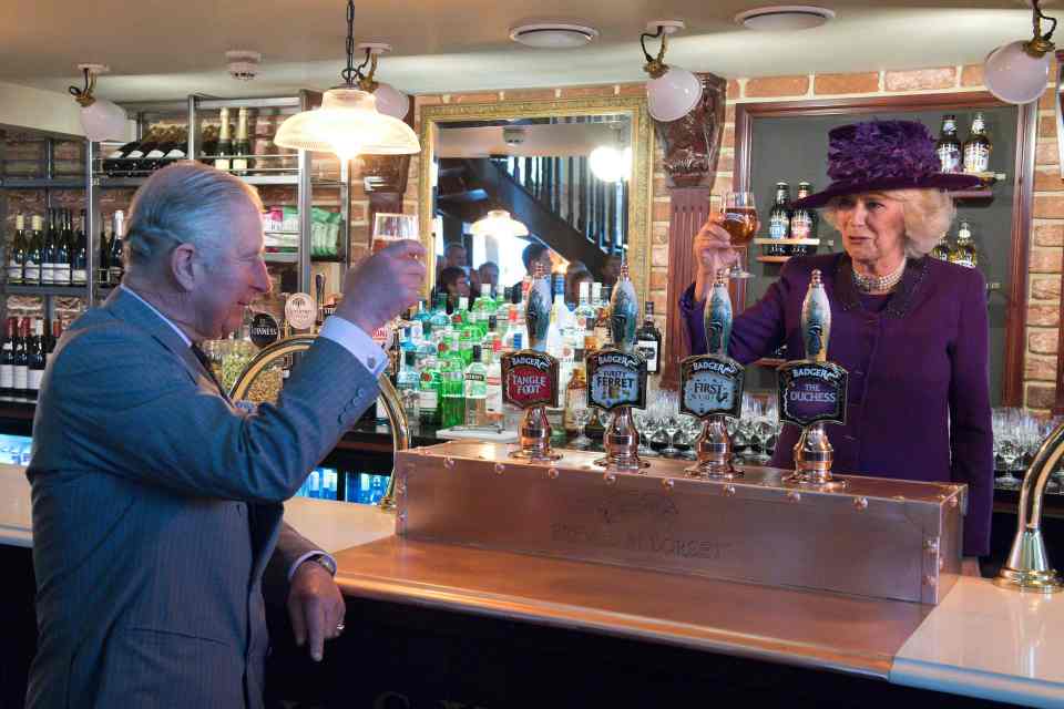  Prince Charles and the Duchess of Cornwall toast each other's health as they share a drink