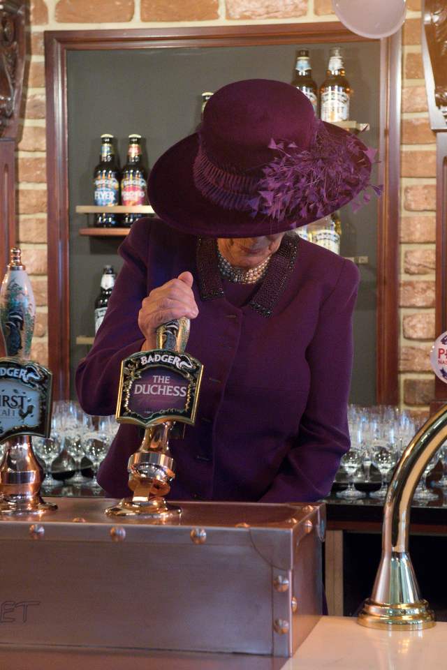  The Duchess of Cornwall got stuck in and poured a half pint of "The Duchess" which she served to her husband