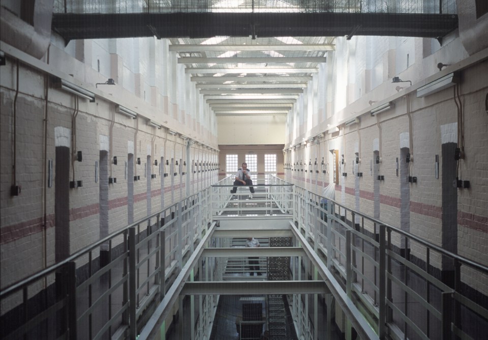 A lone prison officer on a wing at Winchester Prison