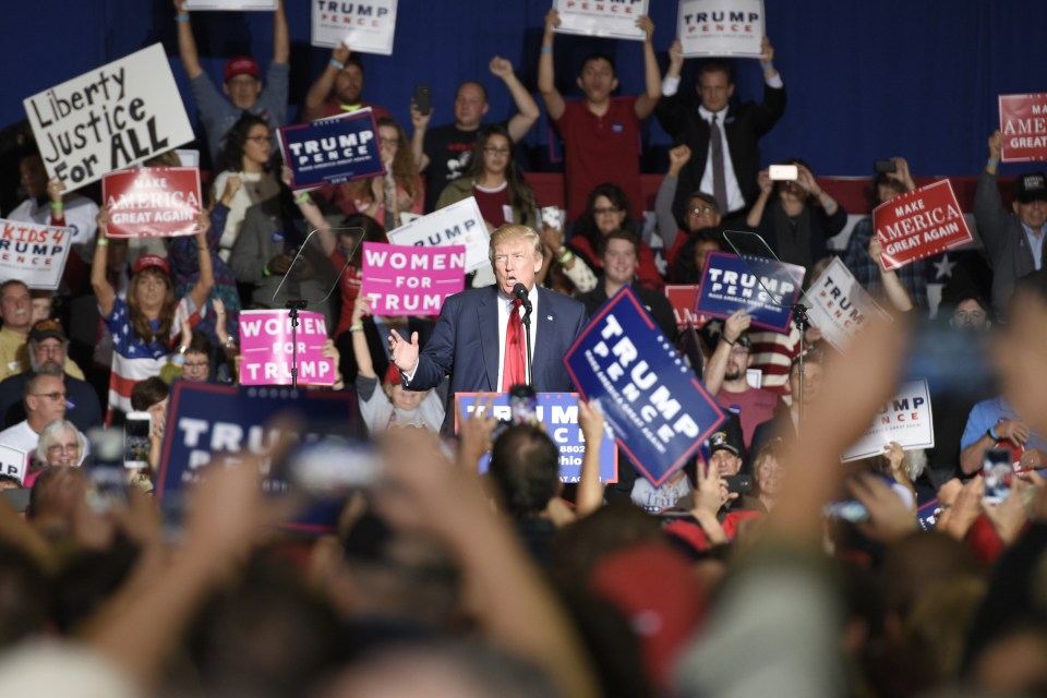  Dozens waved banners with the slogan 'Make America Great Again' and 'Women for Trump' despite the recent sex allegations facing the presidential candidate