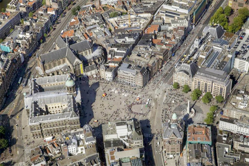  The flat is in the heart of the city's busy Dam Square