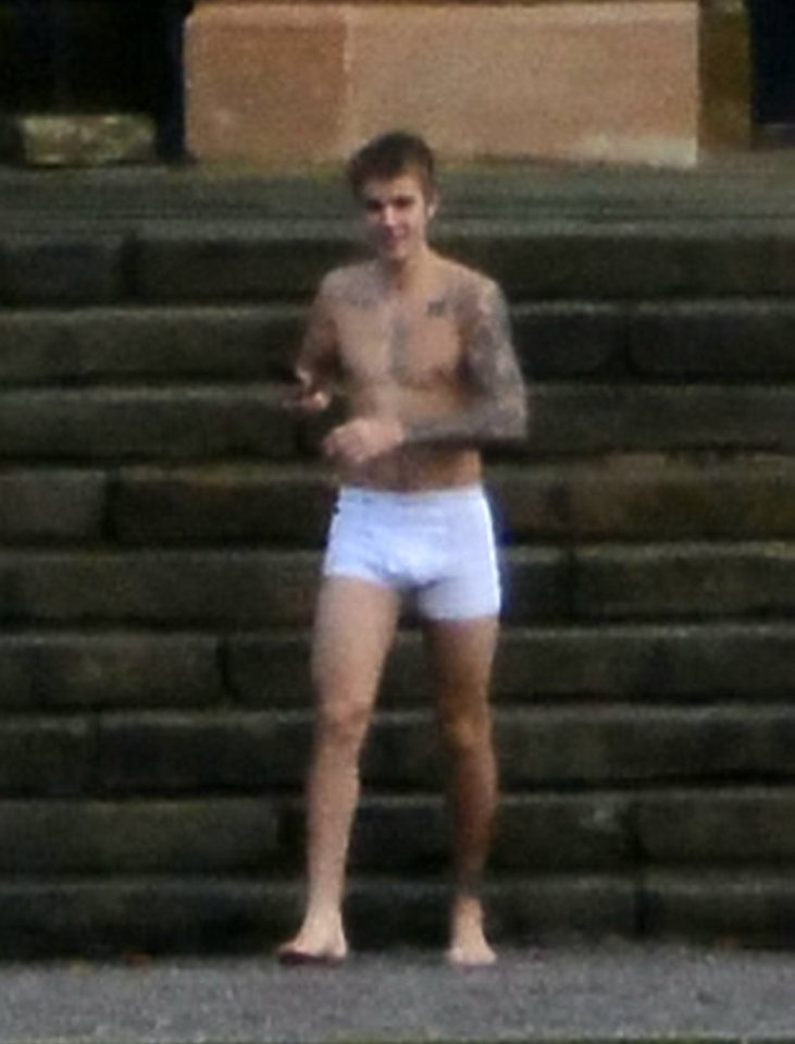  Justin Bieber steps out of his recently Scottish mansion in just his white pants