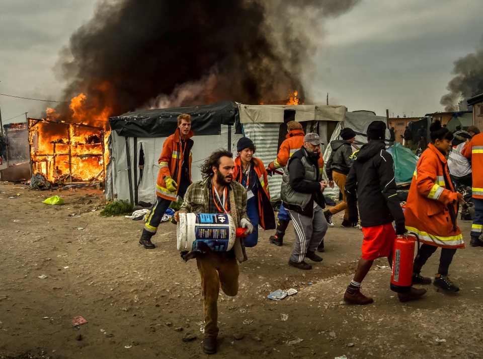  Crews fight to put out fires in Calais camp