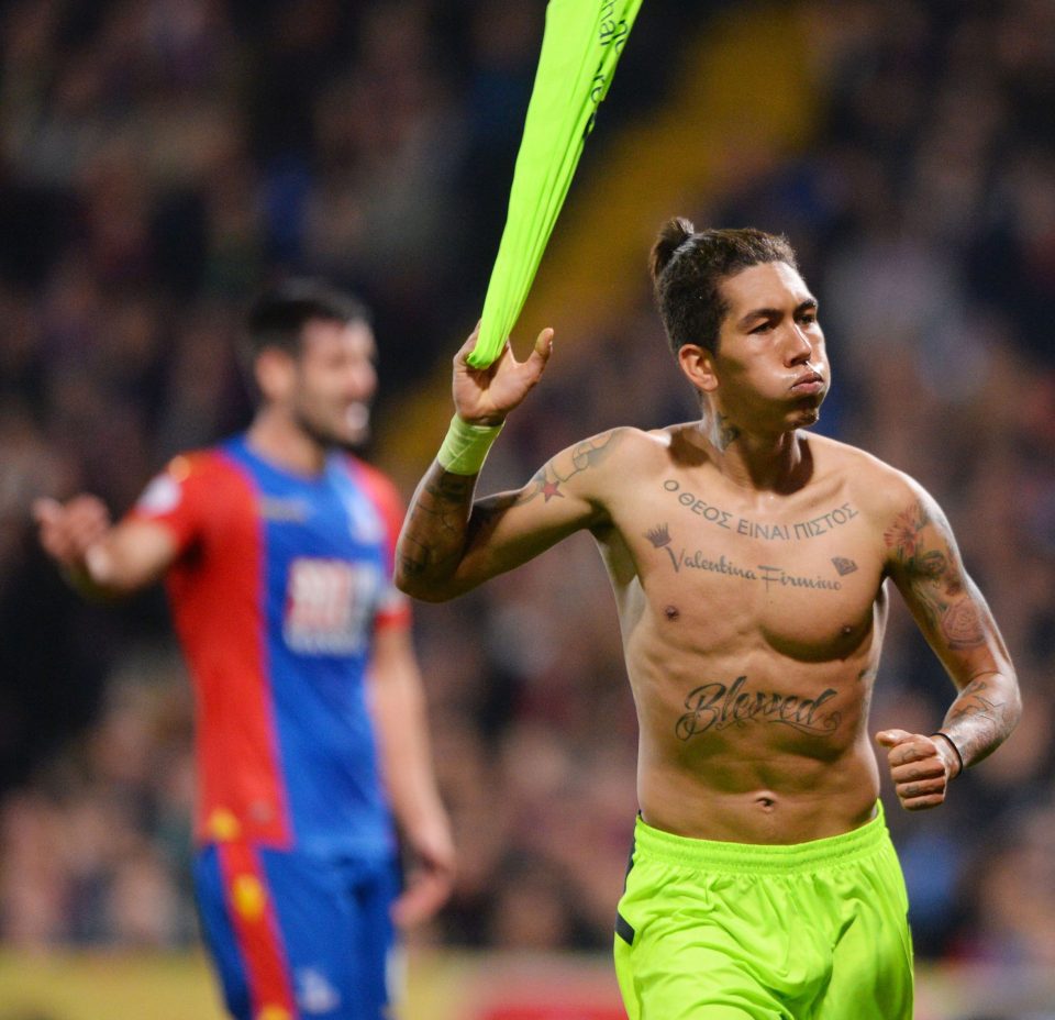 Roberto Firmino celebrates after slotting in Liverpool's fourth