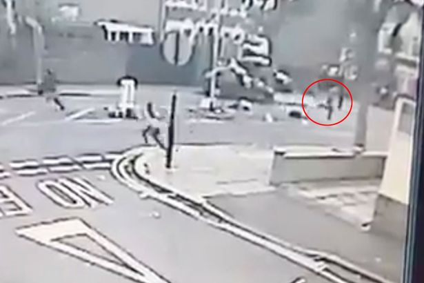  The disgraceful driver makes a run for it as his victims lie in the road