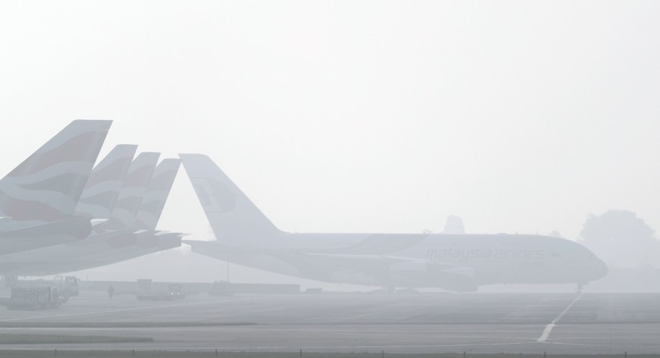  Planes in the fog at Heathrow Airport today as Britain heads into a wintry spell of weather