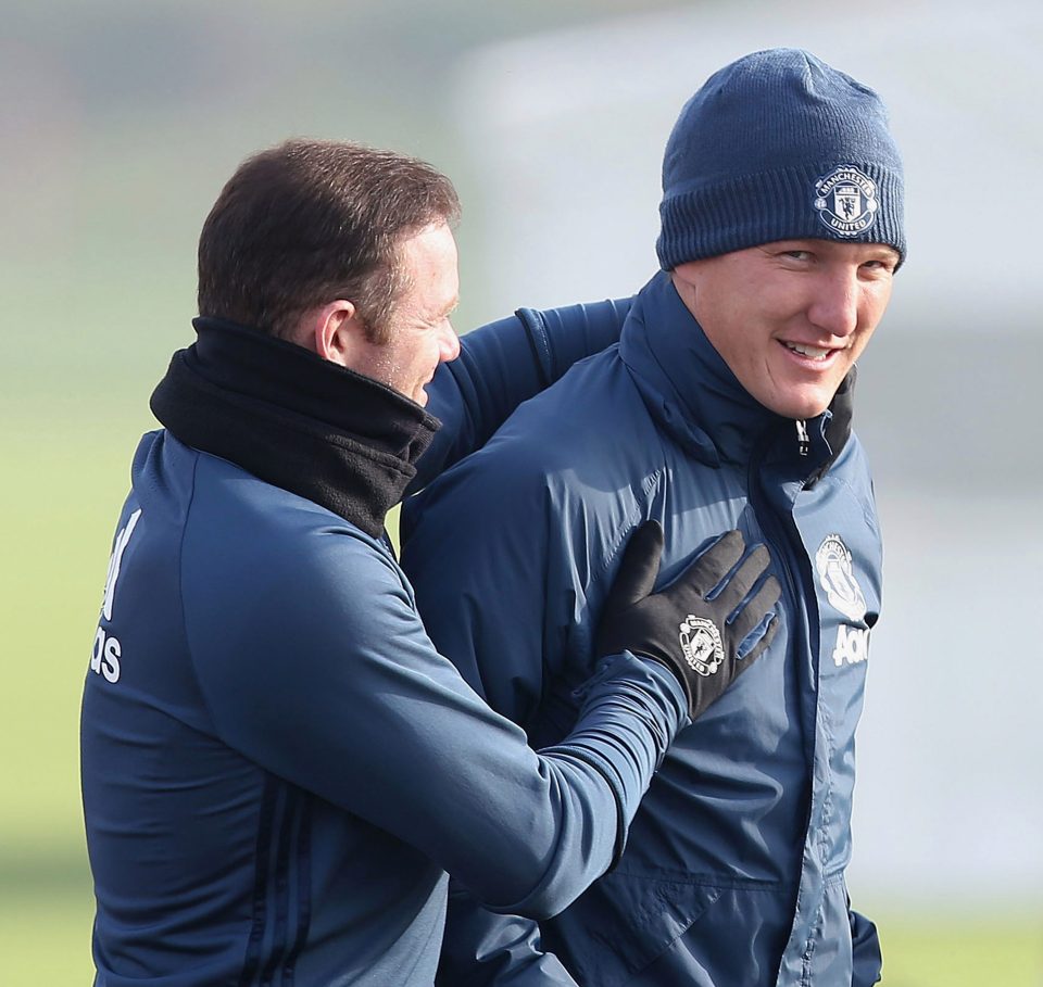  Captain Wayne Rooney looked delighted to see Bastian Schweinsteiger return to first team training