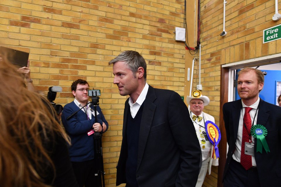  A sombre Zac Goldsmith ascends the stage after his electoral mauling