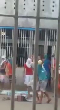 The horrifying moment Brazilian inmates behead a prisoner... and play football with his HEAD