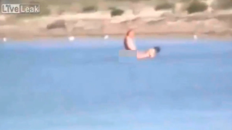  The couple are filmed romping in the sea in broad daylight