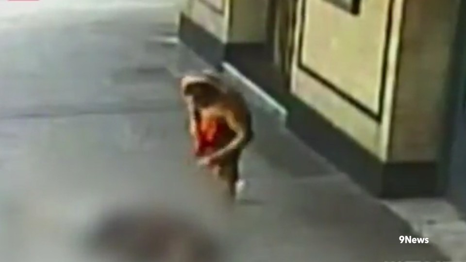  The jogger appears to taunt the victim as he lies crumpled in the street