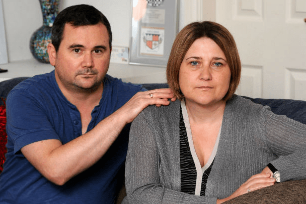  Mel, pictured here with husband and full-time carer Charlie, has had her benefits slashed because she squeezed an assessor's thumb