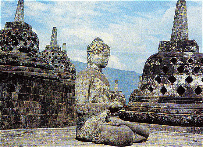  A statue of Buddha at the temple of Borobudur, Java.