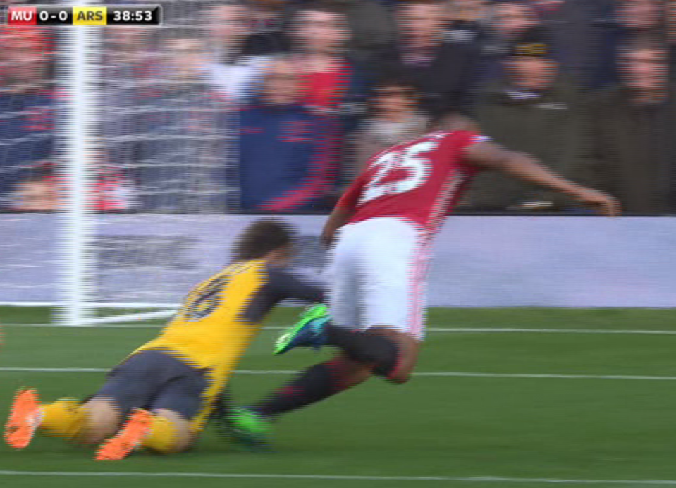  The Arsenal defender looked to drag his arm across the winger's leg