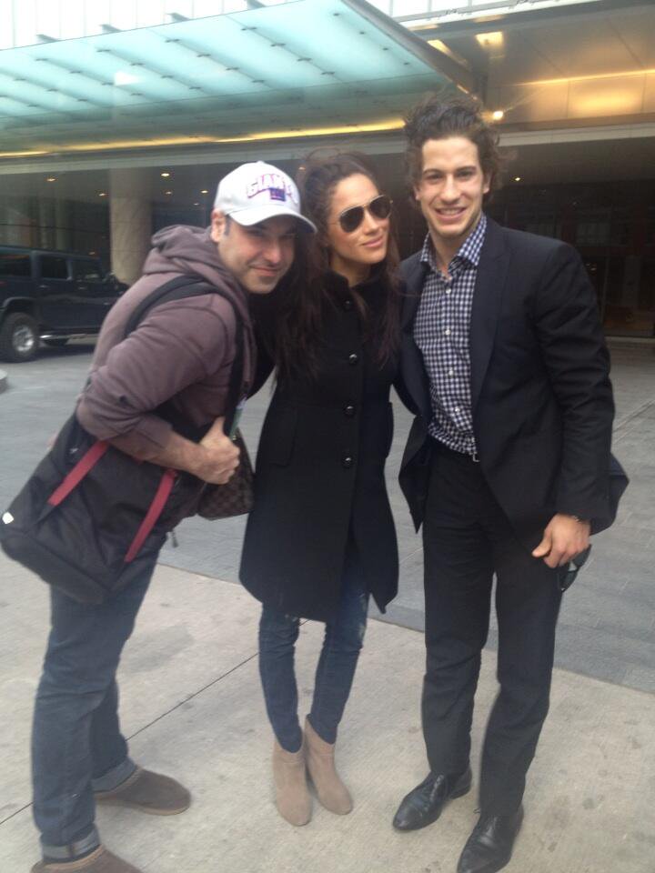 Michael Del Zotto (right) with Meghan Markle and an unknown man. Captioned "Pregame warm up ;)"